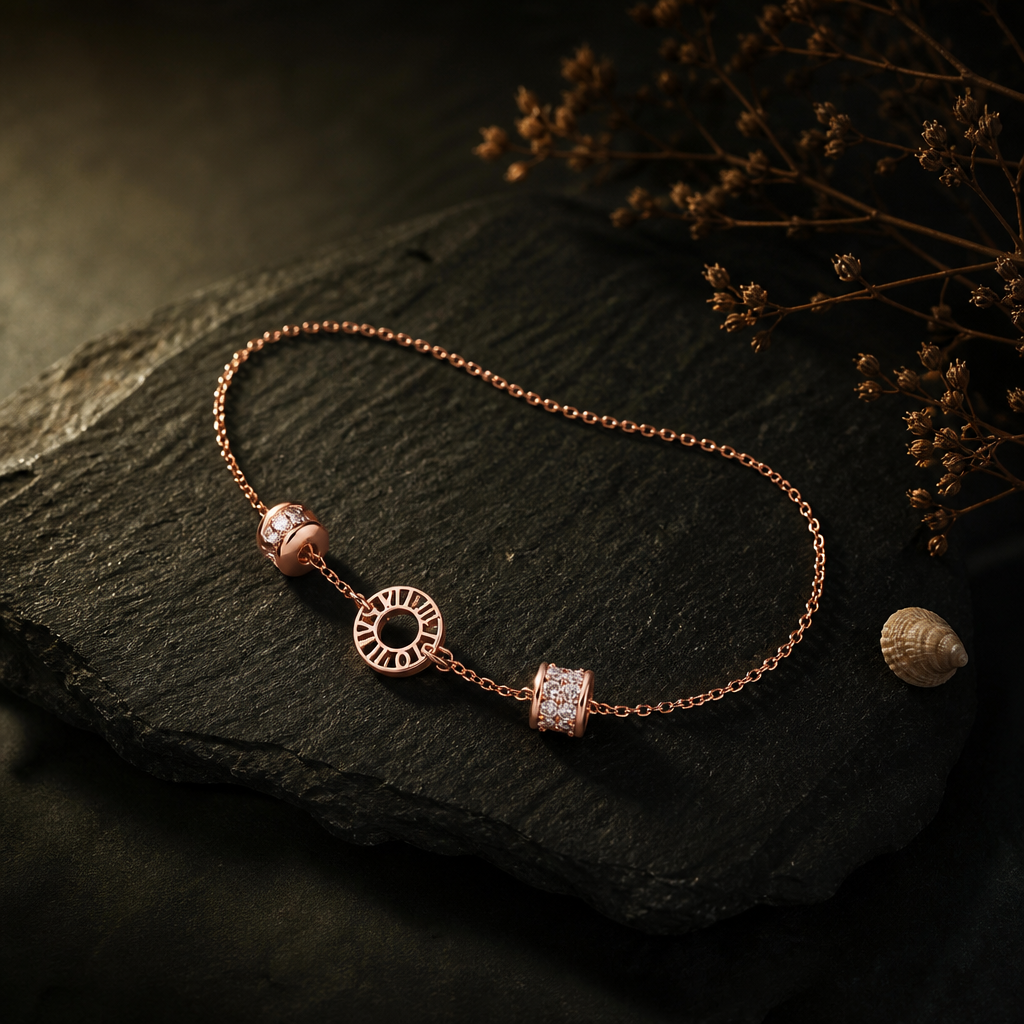 Rose-gold bracelet with a Roman numeral plaque on dark wood